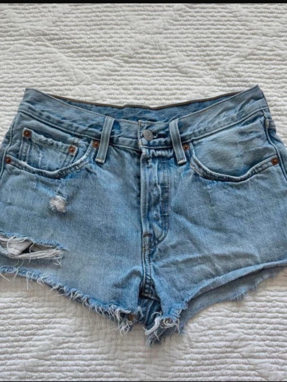 Levi's 501 blue denim high waisted distressed mini shorts. Size 26